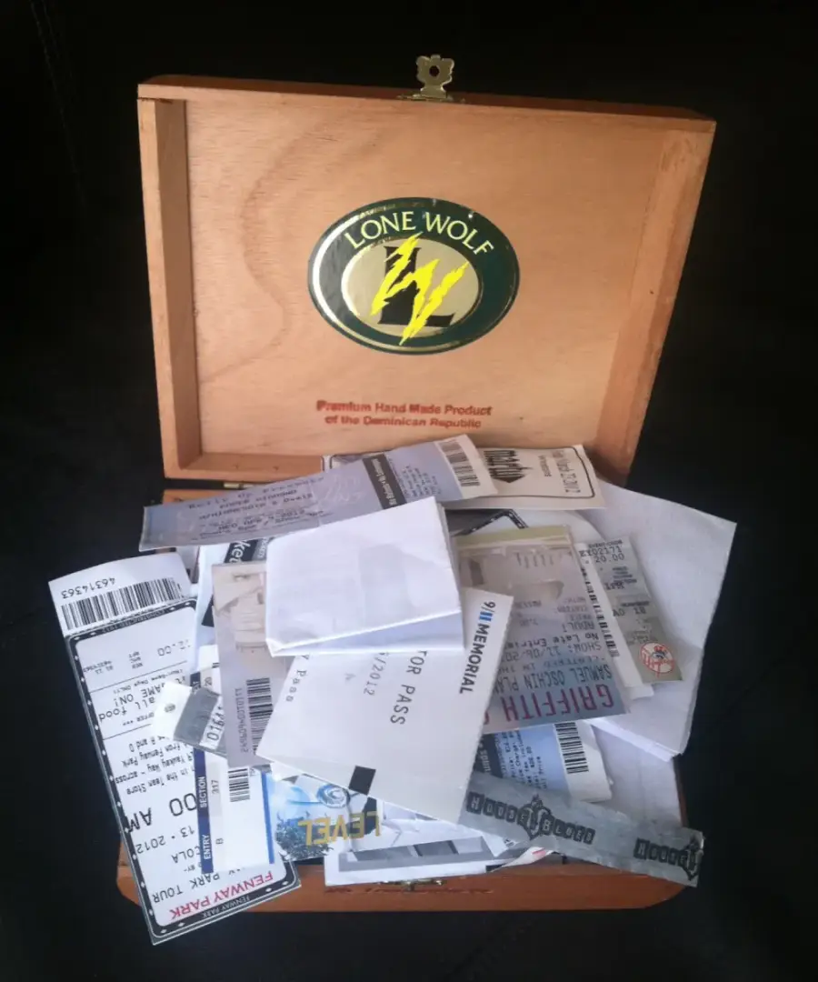 Old ticket stubs and memorabilia in a cigar box, the kind of scattered fan history Ticket Timeline organizes